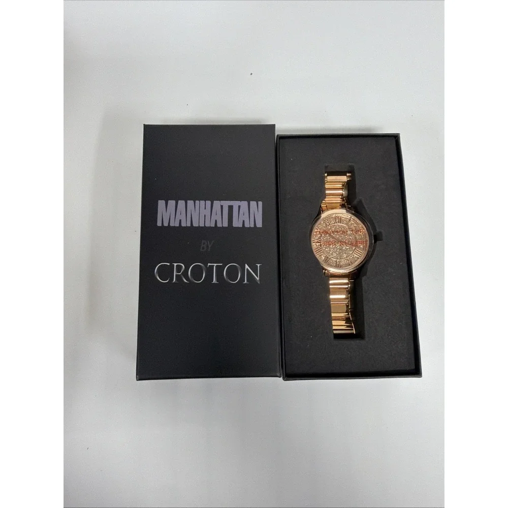 Croton Manhattan watch features‎ a gold-tone design